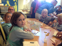 A fleet of colourful sailing boats made by children under the instruction of Margaret Taylor-Hill.